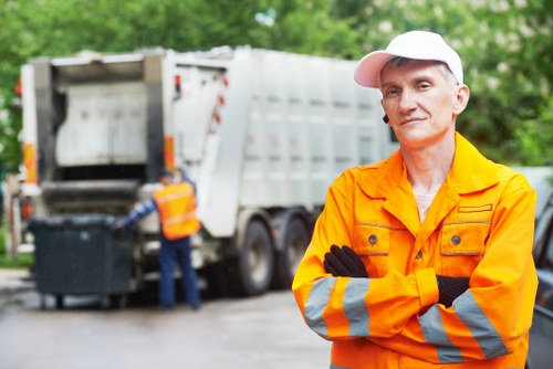 Commercial waste crew preparing for collection at a commercial site
